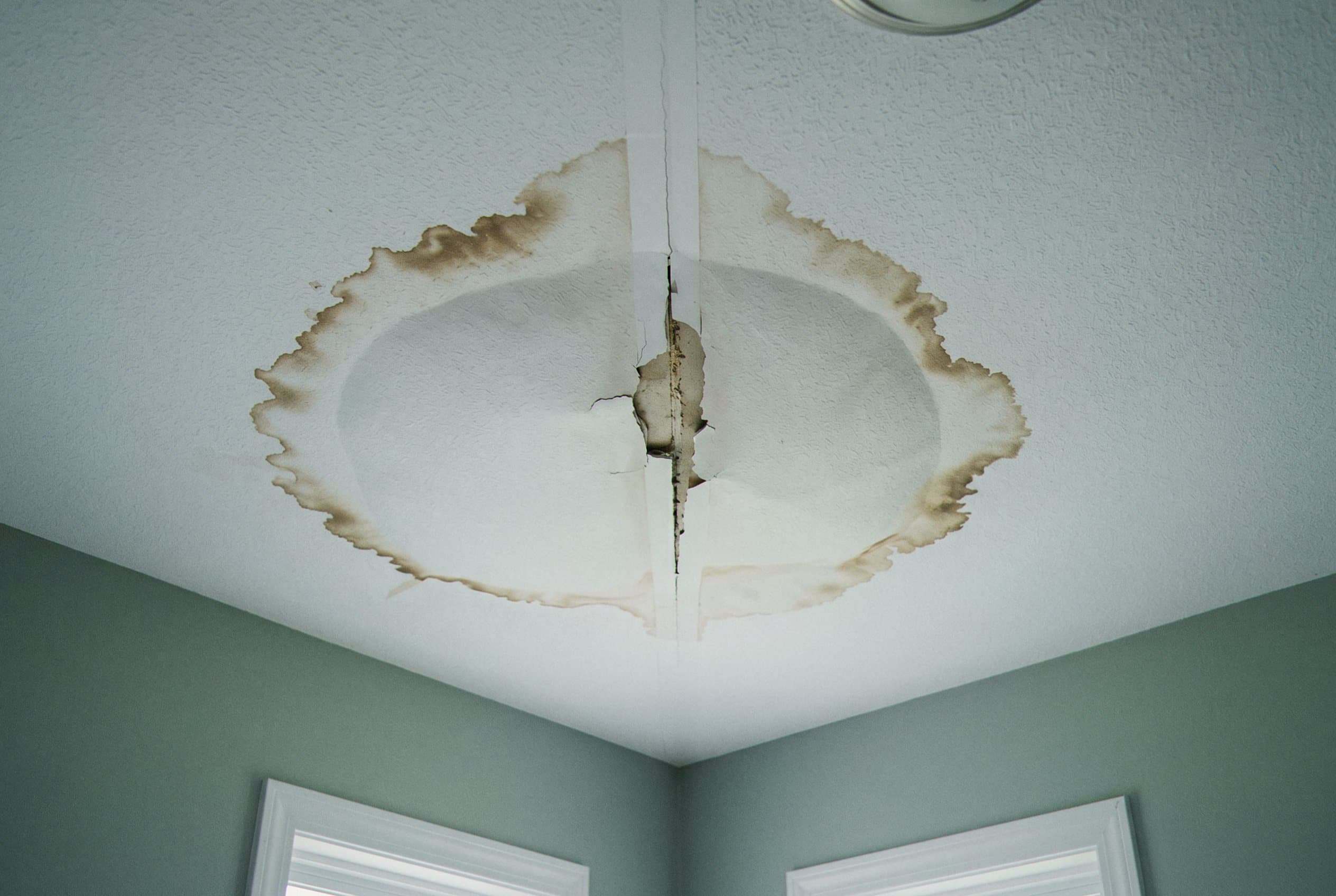 Water stain on ceiling and upper wall
